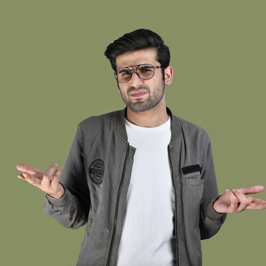 Young man shrugging, unsure what to do