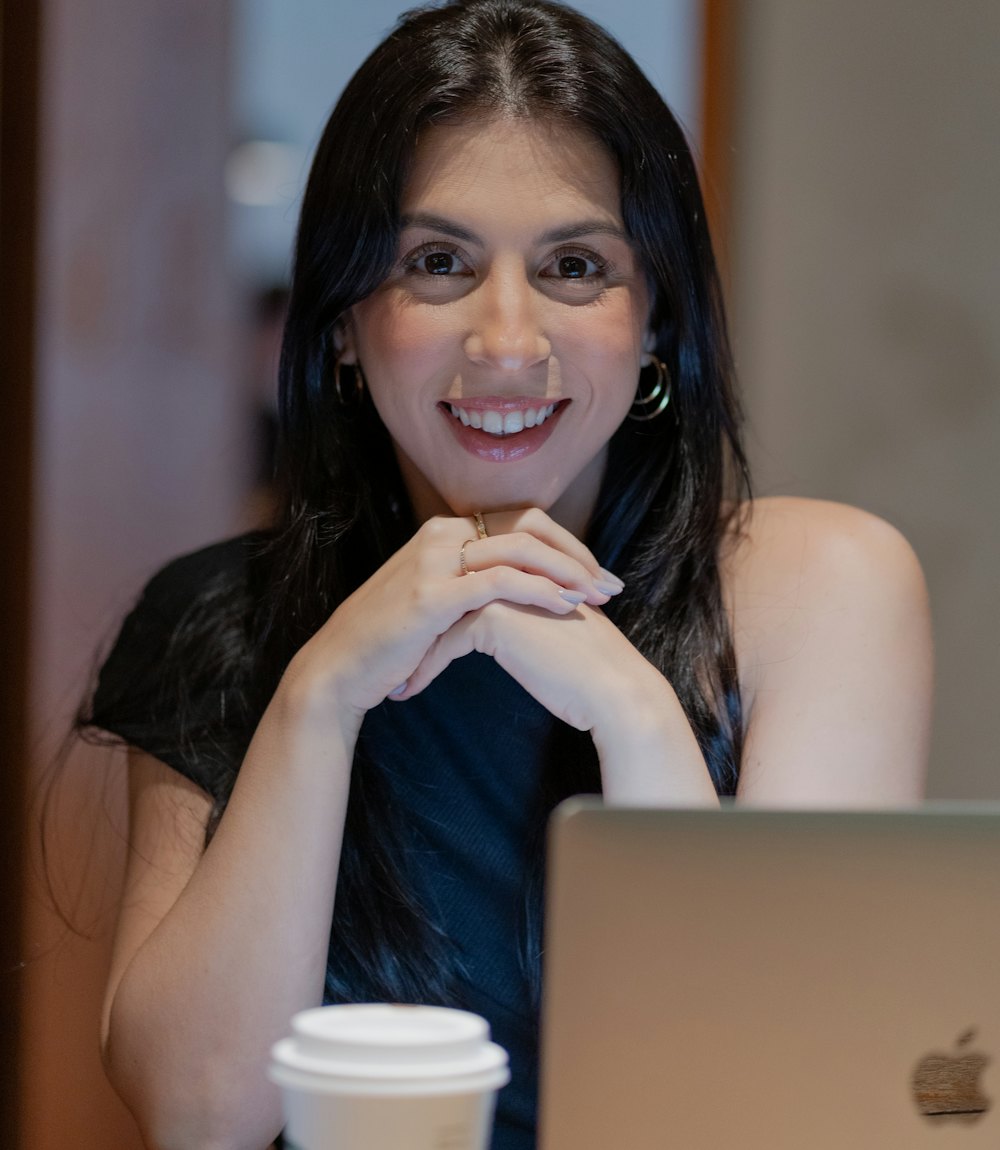 Smiling young woman at her laptop